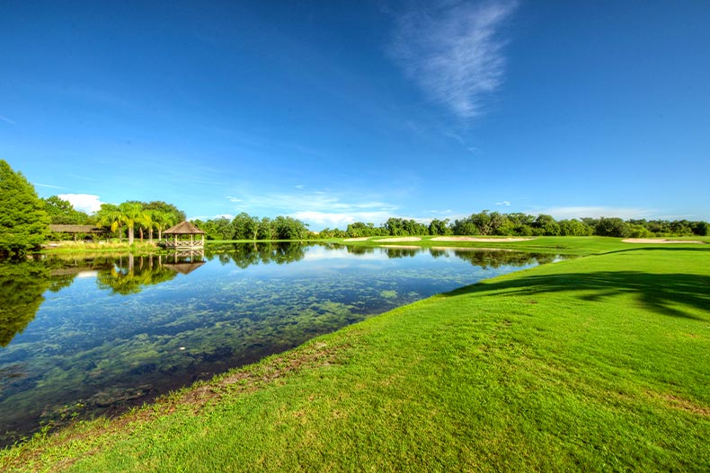A clear pond and gazebo next to a golf course in Lake Ashton, Lake Wales, Florida