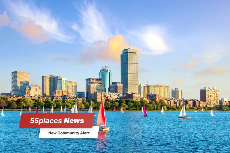View of Boston Skyline in summer afternoon with 55places News text overlay and New Community Alert banner.