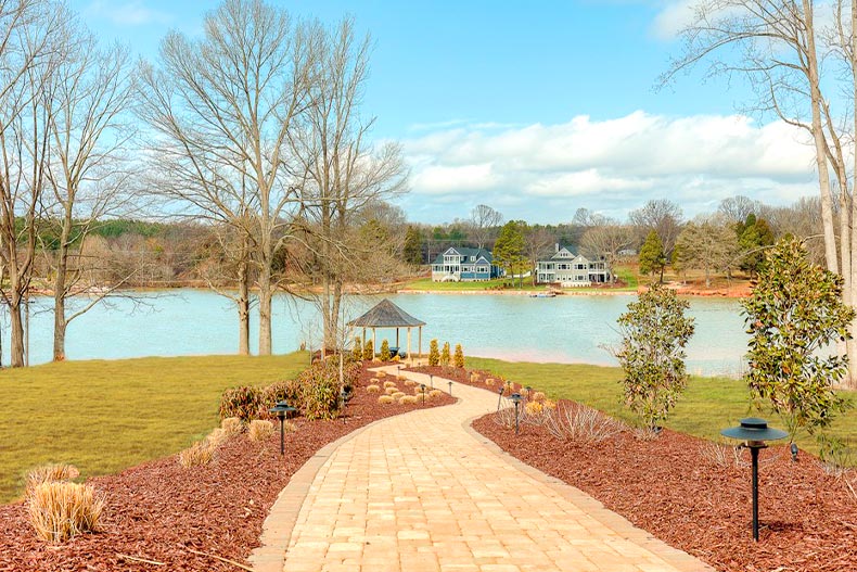 Pathway leading up to a gazebo on a lake in Lake Walk of Moorseville, North Carolina