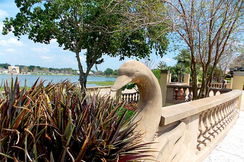 A concrete swan decorating the railing of Hollis Park in Lakeland, Florida