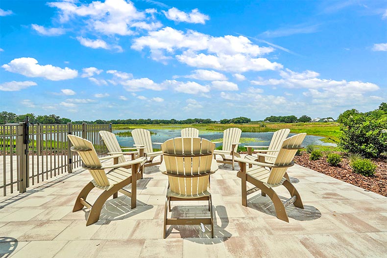 Chairs around an outdoor fire pit at Lakeshore in Oxford, Florida