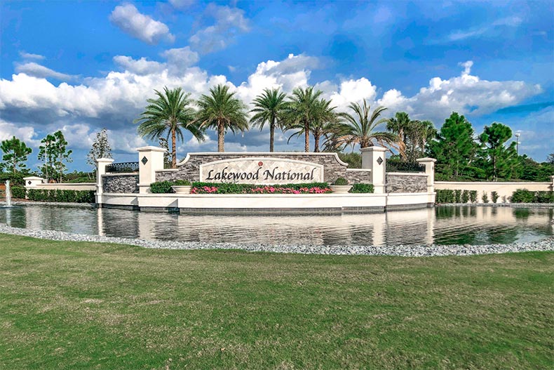 Palm trees surrounding the community sign for Lakewood National in Lakewood Ranch, Florida