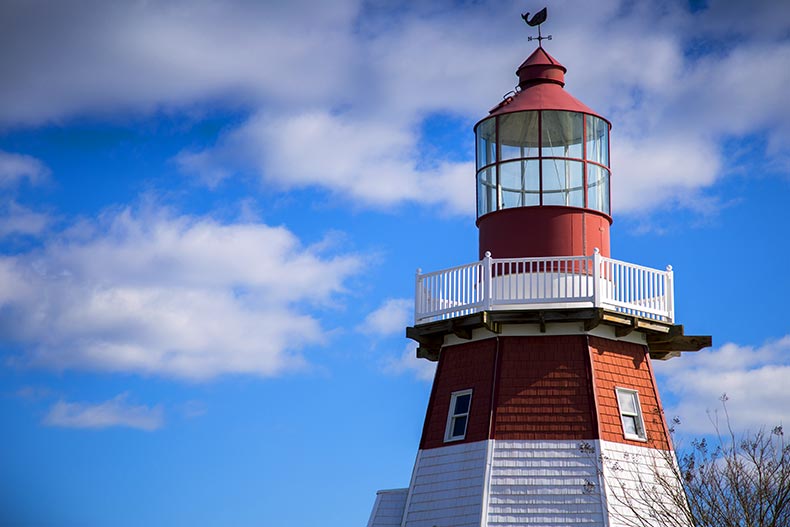 The read and white top of a lighthouse located in Toms River, New Jersey