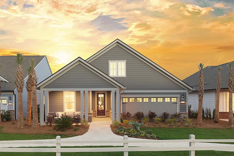 Exterior sunset view of a model home at Sun City Hilton Head in Bluffton, South Carolina