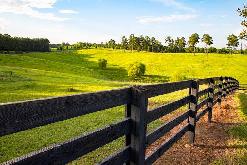 A fence along an idyllic horse ranch in Macon, Georgia