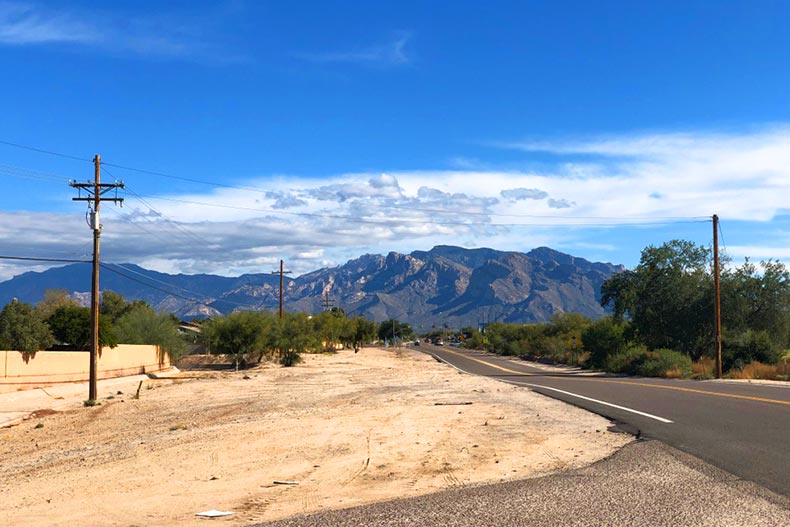 View down a road in Marana, Arizona towards a mountain in the distance