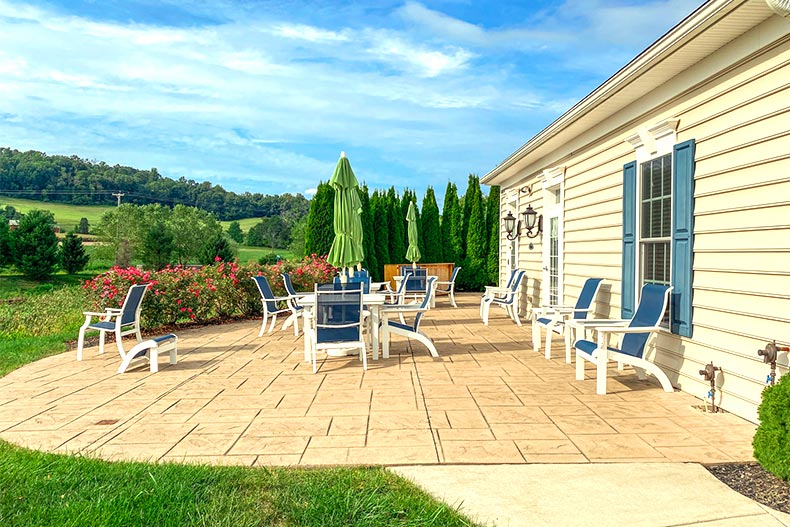 View of blue chairs on a patio outside of the clubhouse at Meadow View Farms in Oley, Pennsylvania