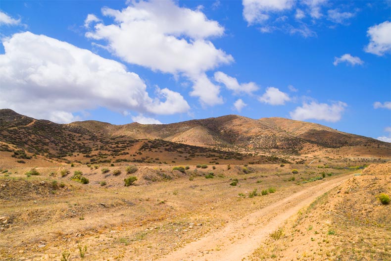 A dirt road leading through the Southern California desert in Menifee, California