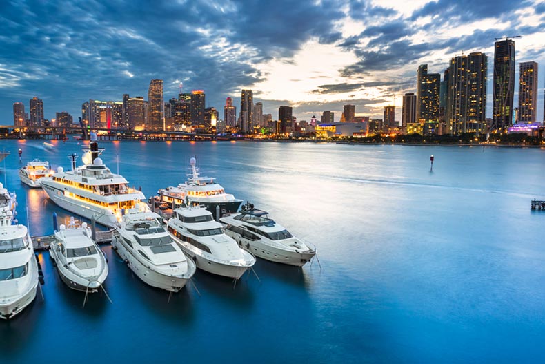 Yachts and boats on the water with the Miami skyline in the background