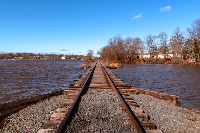 Railroad tracks cross Manalapan Lake in Thompson Park in Middlesex County, New Jersey