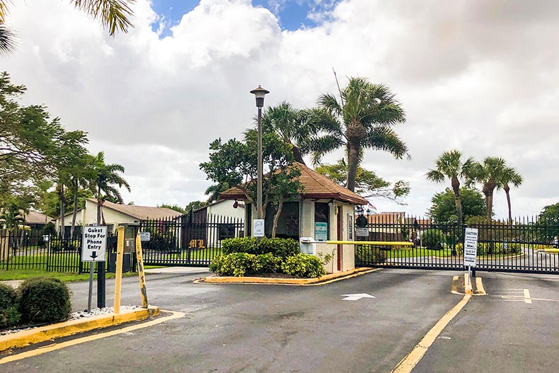 Palm trees surrounding the gate house at Mirror Lakes in Boynton Beach, Florida