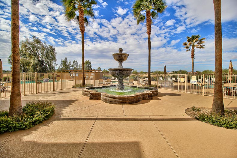 Palm trees surrounding a fountain on the grounds of Mission Royale in Casa Grande, Arizona