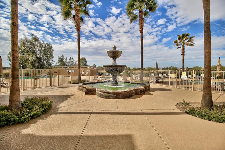 Palm trees surrounding a fountain at Mission Royale in Casa Grande, Arizona