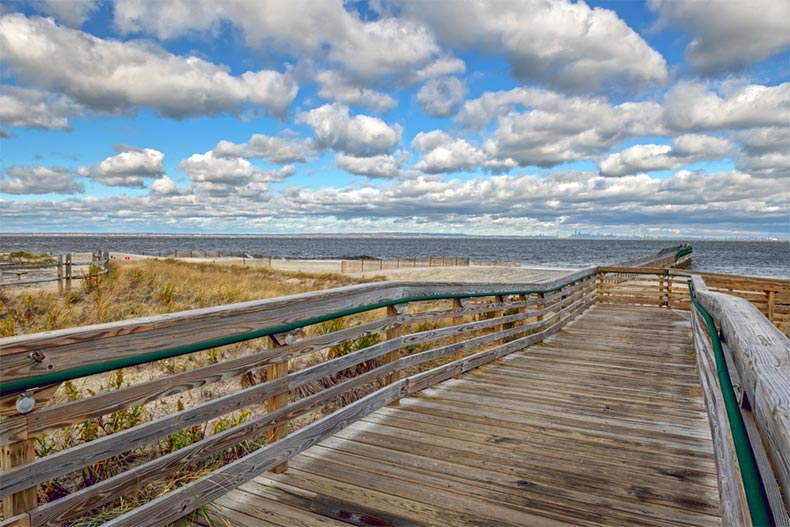 A long wooden fishing pier in Bayshore Waterfront Park in Monmouth County, New Jersey