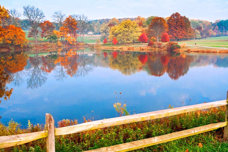 Autumn trees surrounding a lake in Holmdel Park of Monmouth County, New Jersey