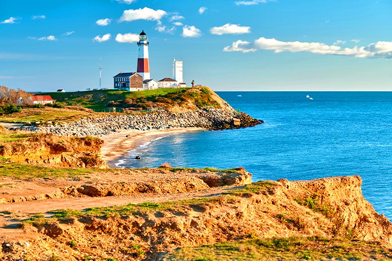  Wide shot of the Montauk Lighthouse and a beach in Long Island, New York