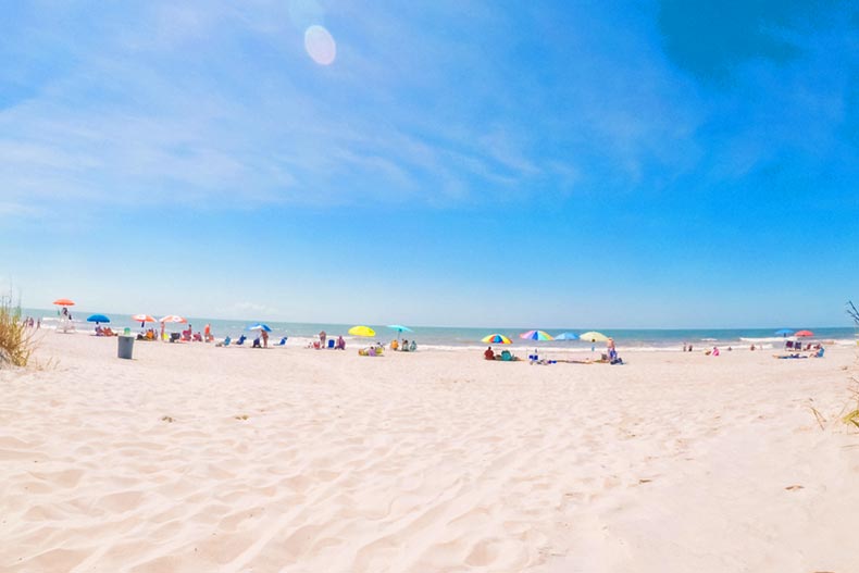 Vacationeers on a beach during a sunny summer day in Southern Carolina