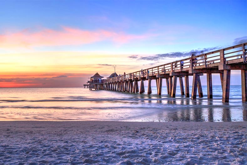 Naples Pier on the beach at sunset in Naples, Florida