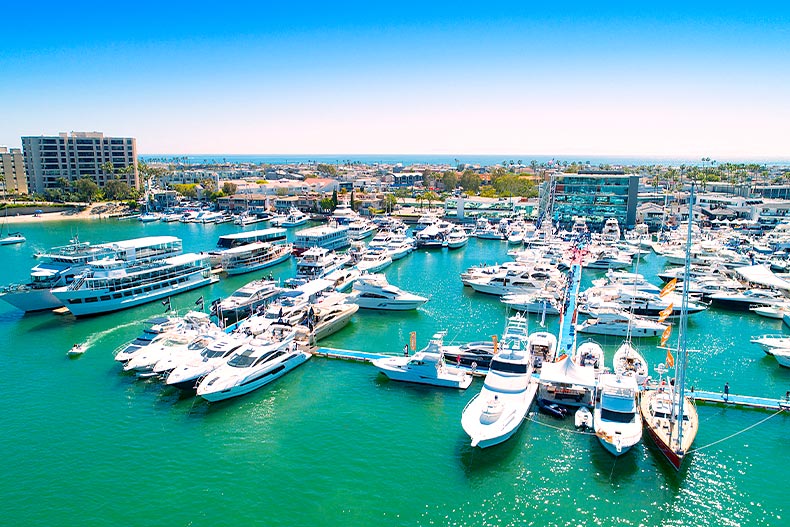Aerial shot of white yachts on Newport Beach Harbor in California