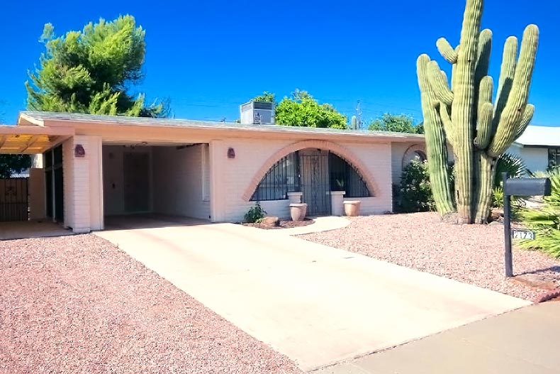 Exterior view of a home in Northtown with a large saguaro cactus in front, located in Phoenix, Arizona