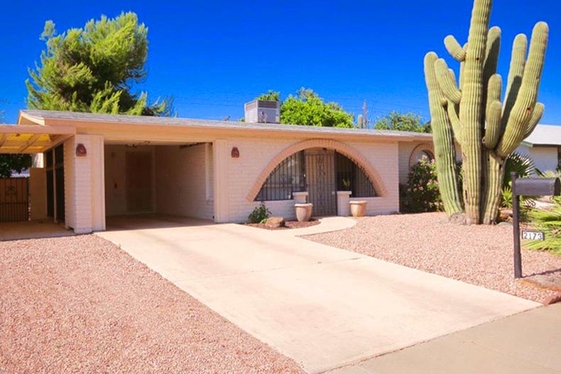 Exterior view of a one-story home in Northtown with a large cactus in front, located in Phoenix, Arizona