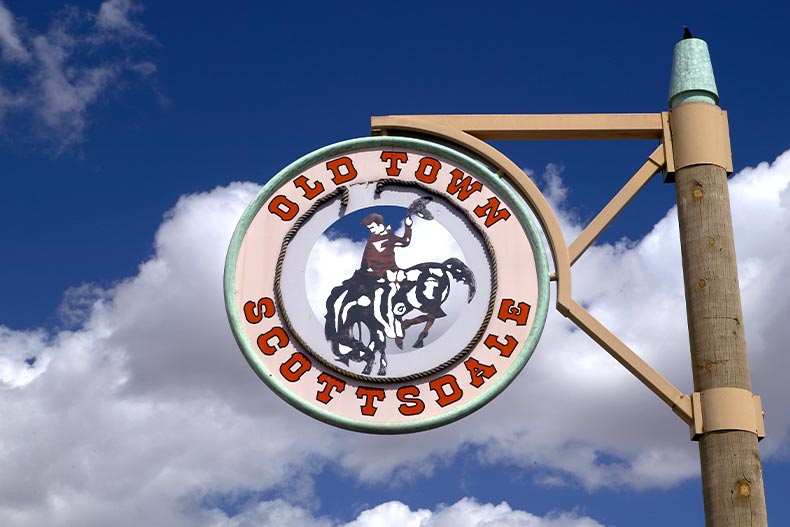 Circular sign for Old Town Scottsdale, Arizona with a cowboy in the center