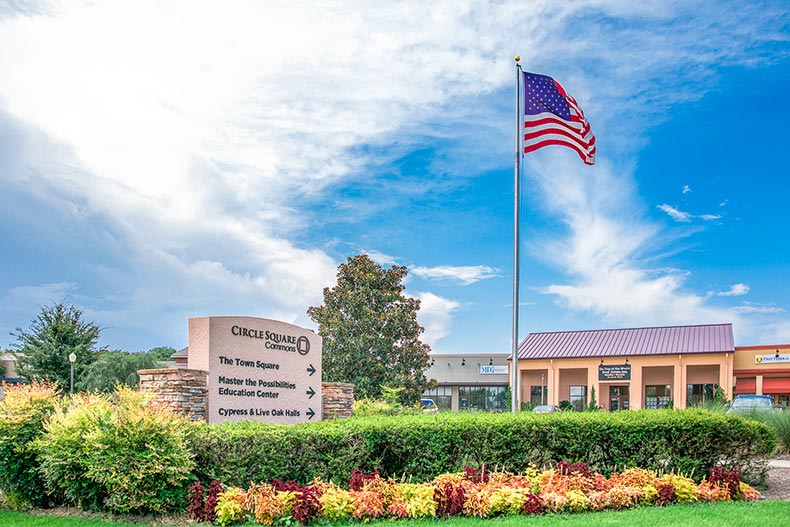 Greenery surrounding the sign for Circle Square Commons at On Top of the World in Ocala, Florida