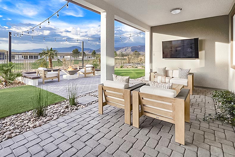 The outdoor patio and fireplace at Ovation at Mountain Falls in Pahrump, Nevada