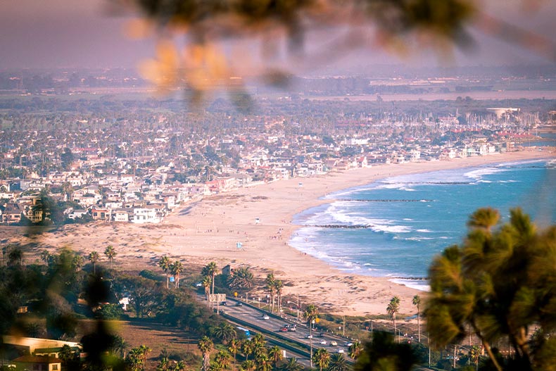 Aerial shot of a beach, a highway, and residential area in Oxnard, California