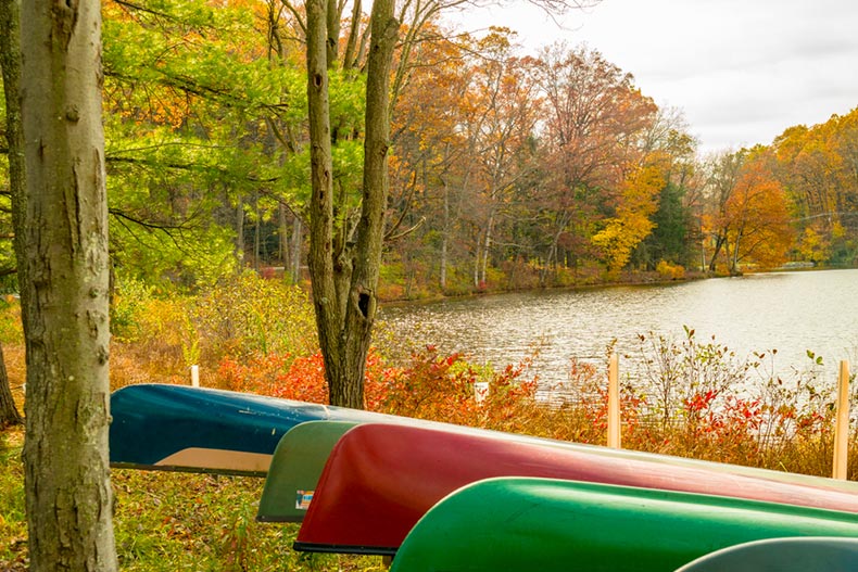 Canoes at the edge of a scenic lake in mid-autumn in Lebanon County, Pennsylvania