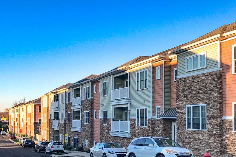 Blue sky over a row of condo buildings at Village Of Southampton in Southampton, Pennsylvania