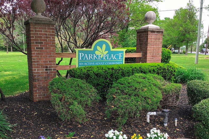 Greenery surrounding the community sign for Parke Place in Sewell, New Jersey