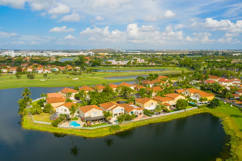 An aerial view of houses lining a lake in Pembroke Pines, Florida