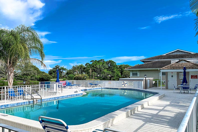 Lounge chairs beside the outdoor pool at Perico Bay Club in Bradenton, Florida