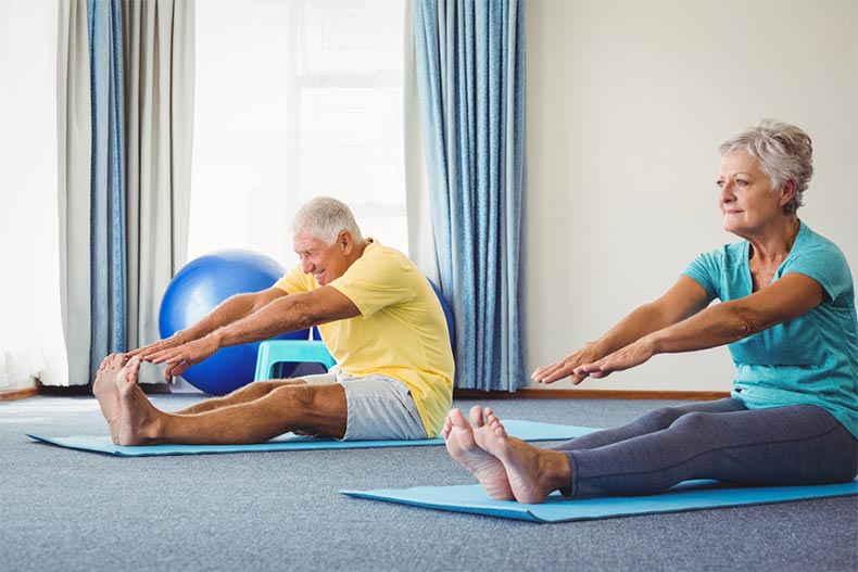 Senior couple doing exercises in a studio