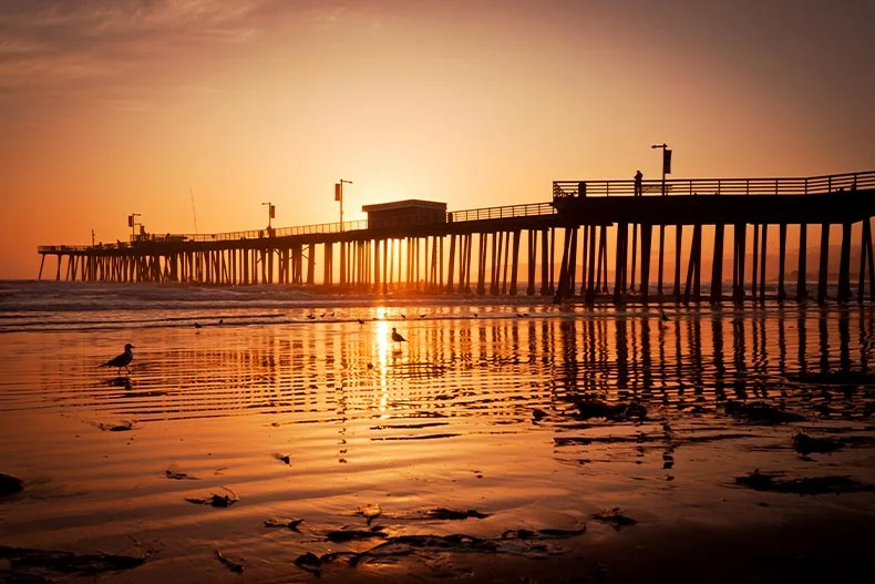 Photo of a pier in Pismo Beach, California at sunset