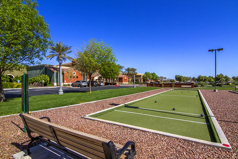 A bench beside the bocce ball courts at Province in Maricopa, Arizona