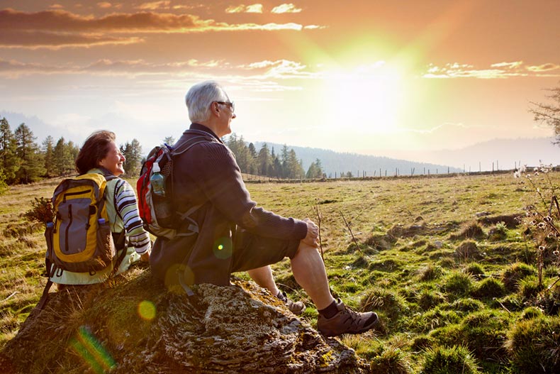 Seniors hiking in nature on an autumn day