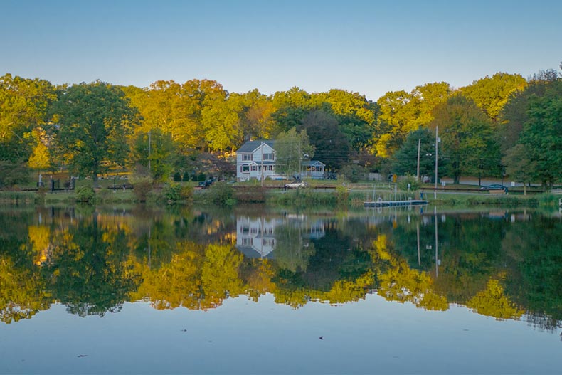 A mirror reflection of a house on a lake in Rockaway, New Jersey