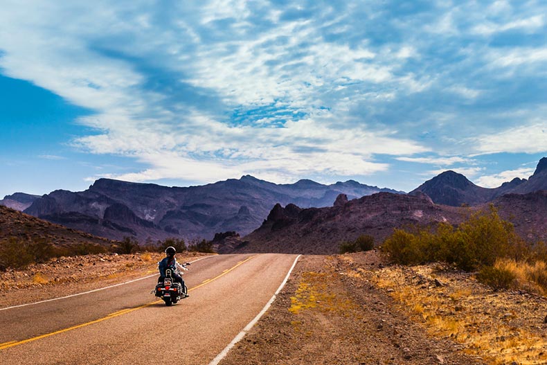 A biker driving on Route 66 to Oatman, Arizona