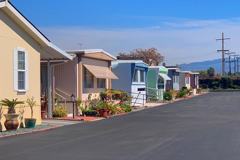 A row of colorful mobile homes in a trailer park