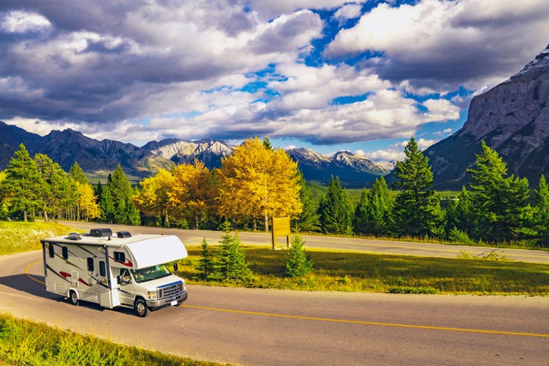 An RV on a scenic highway in autumn