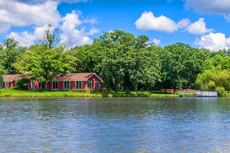 Photo of a red house on the bank of a lake in Saddlebrook Farms in Grayslake, Illinois