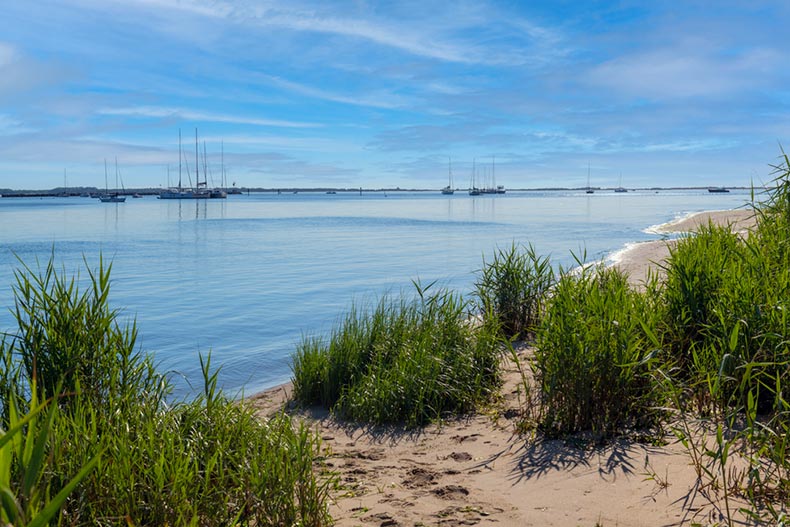 View from the Atlantic Highlands shoreline of sailboats on Sandy Hook Bay in New Jersey