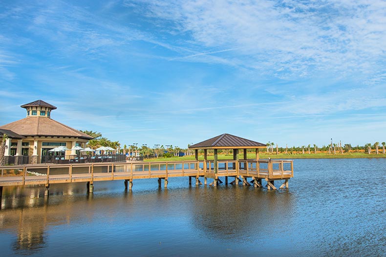 A dock extending into a picturesque pond at Del Webb Lakewood Ranch in Lakewood Ranch, Florida