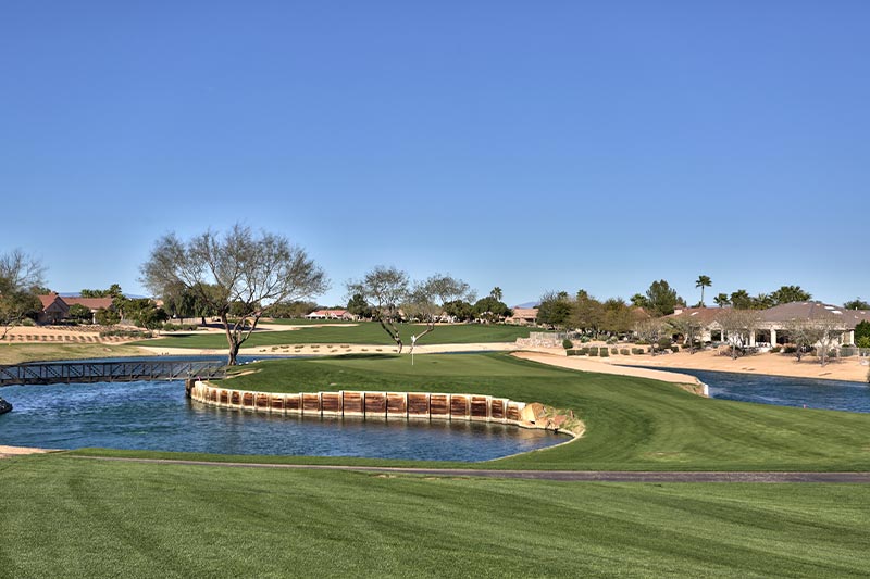 View of the fairways at the Sun City Grand golf course on a sunny day.