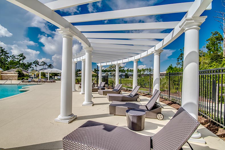 Lounge chairs beside the outdoor pool at Seasons at Prince Creek West in Murrells Inlet, South Carolina