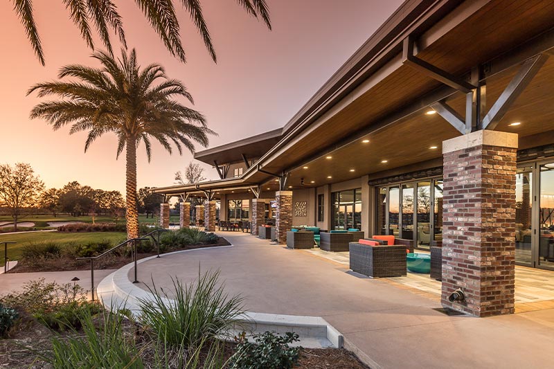 Shea Homes at Ocala Preserve clubhouse at dusk.