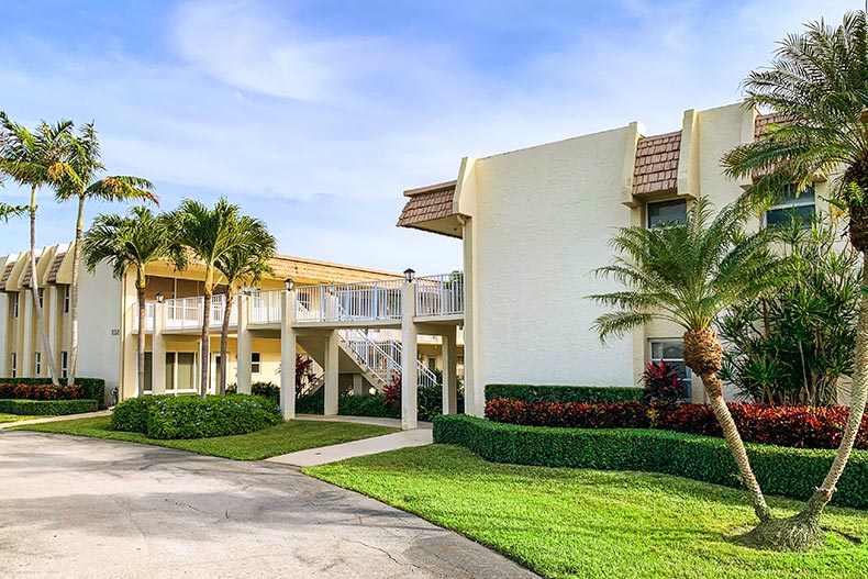 Exterior view of a condo building in Snug Harbor Gardens Condominiums, located in Boynton Beach, Florida