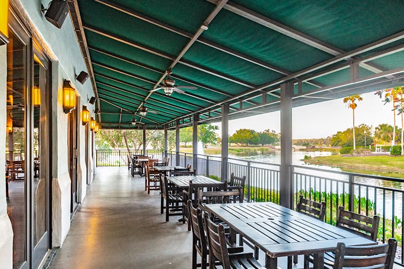 Tables and chairs on an outdoor patio at Solivita in Kissimmee, Florida